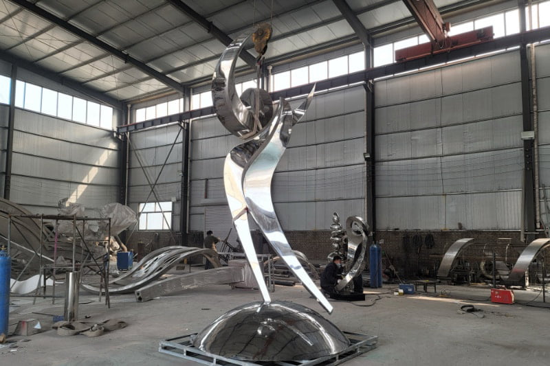 Large-scale sculpture assembly -- monumental artwork under construction