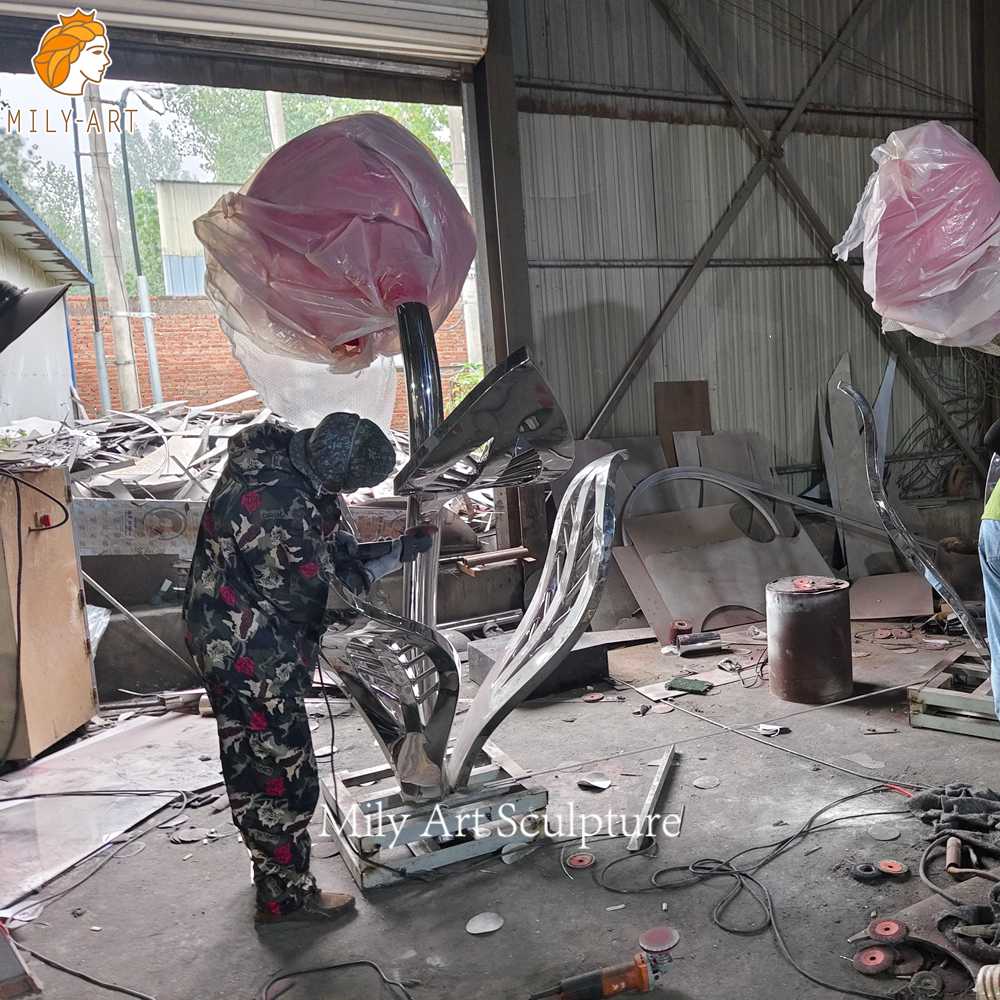 Grinding metal rose sculpture