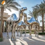 Three Metal Camel Sculptures