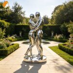 abstract metal couple sculpture garden installation