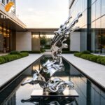 abstract stainless wave sculpture landscape