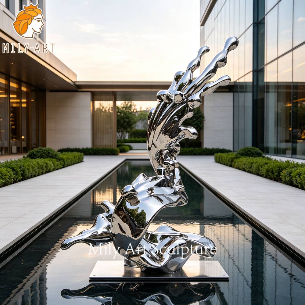 abstract stainless wave sculpture landscape