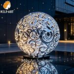 hollow metal sphere sculpture night view