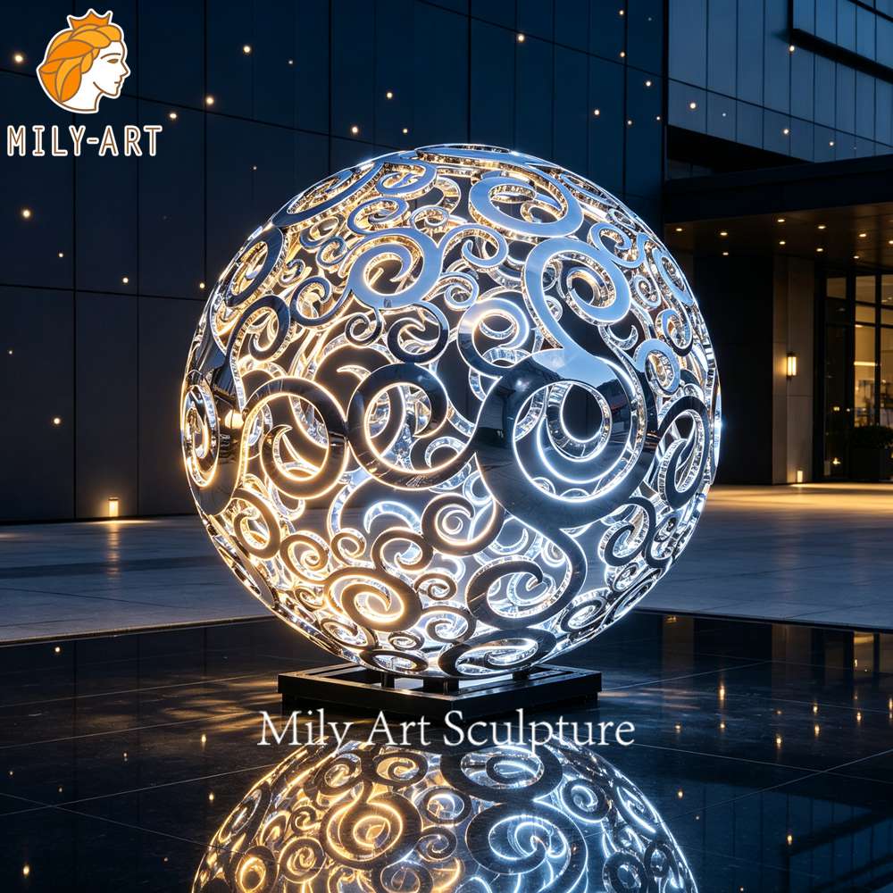 hollow metal sphere sculpture night view