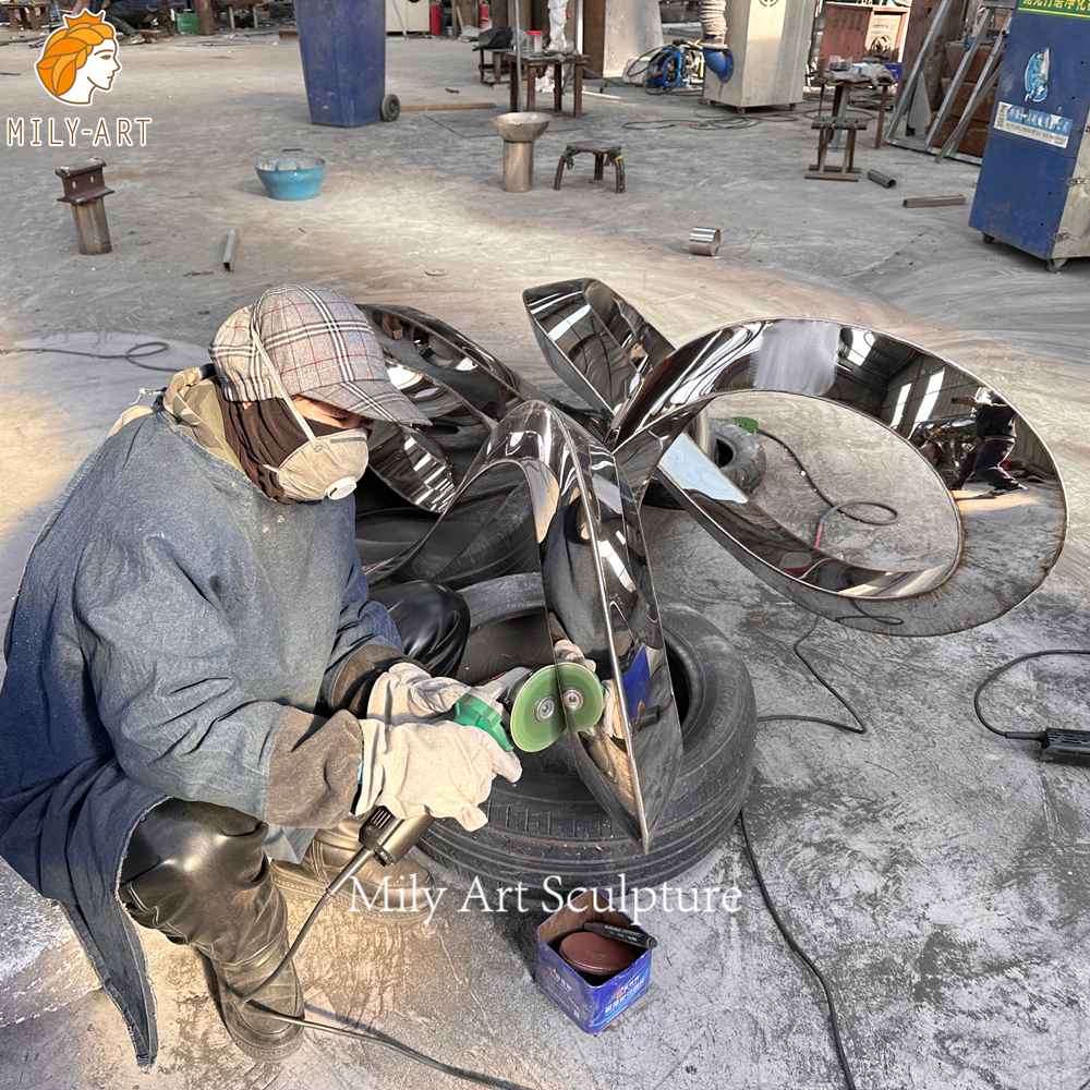 metal ring sculpture polishing