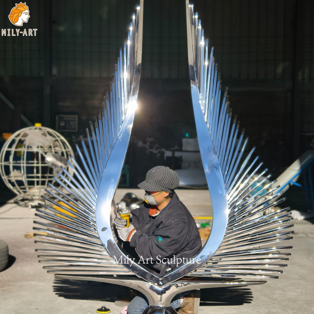 mirror polished metal wing sculpture