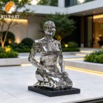 outdoor stainless steel kneeling woman sculpture