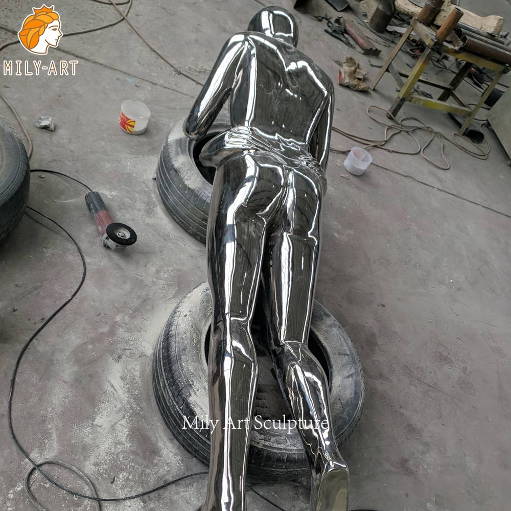 stainless steel couple sculpture hand polishing detail