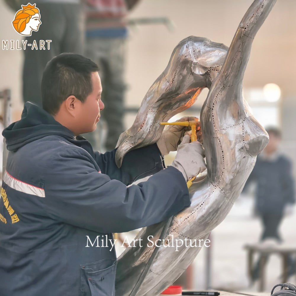 stainless steel mermaid sculpture welding workshop