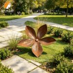 corten steel flower sculpture garden view