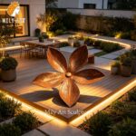 corten steel flower sculpture night lighting