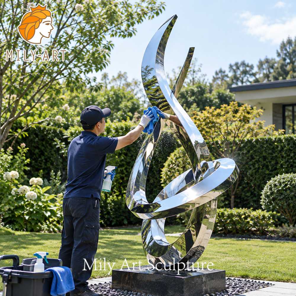 cleaning stainless steel sculpture in garden