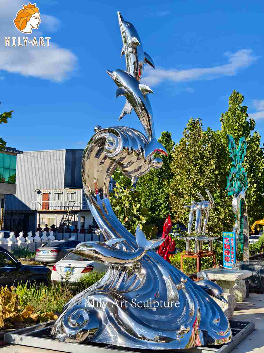large stainless steel dolphin sculpture