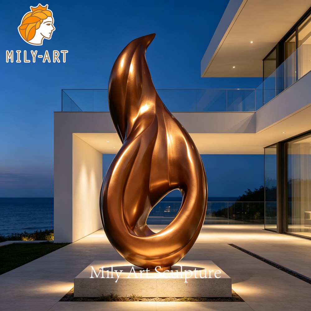 metal flame sculpture garden night