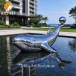 metal whale sculpture luxury waterfront