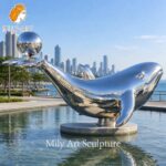 metal whale sculpture resort waterfront