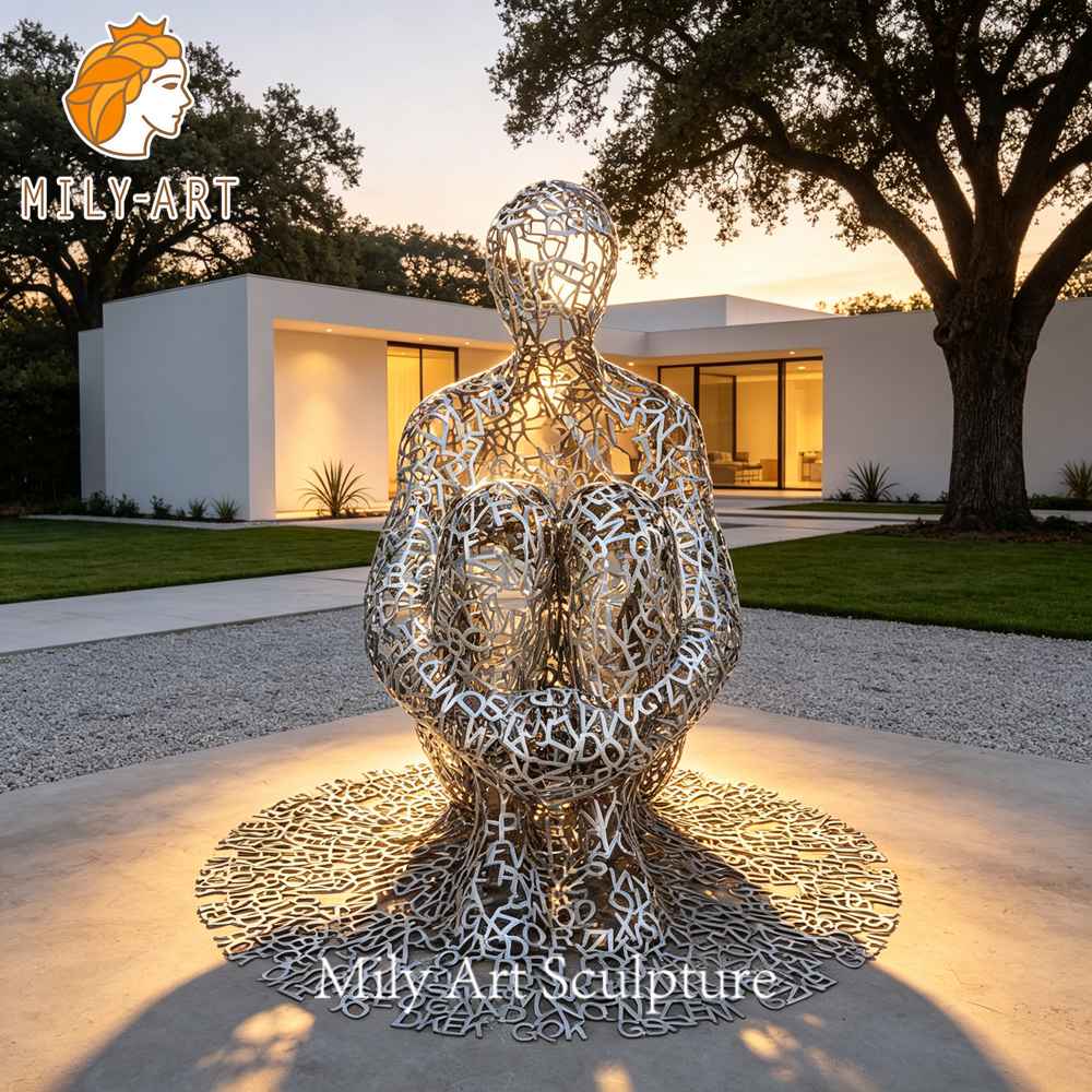 seated metal alphabet statue