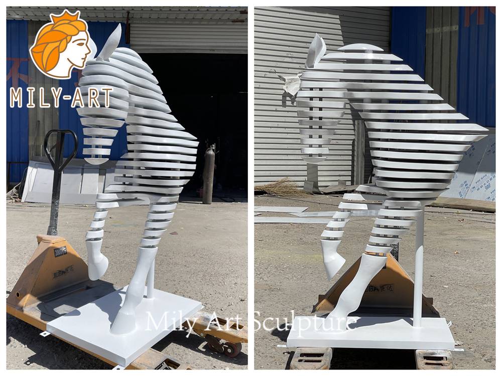 white painted metal horse head sculpture