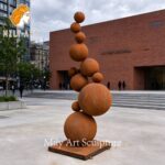 corten steel ball statue