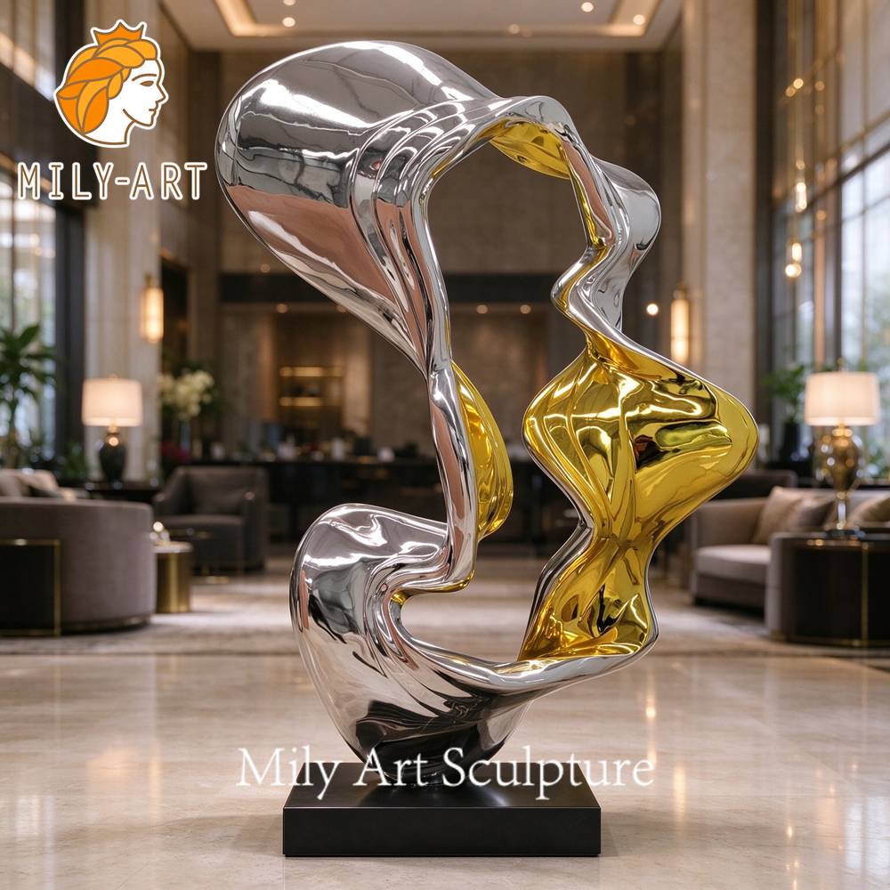 gold and silver stainless steel modern sculpture