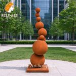 large corten steel ball statue