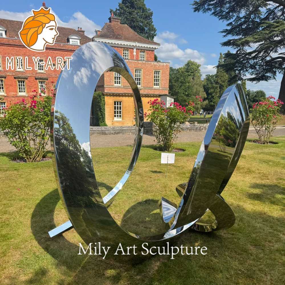 mirror polished stainless steel sculpture in private garden UK