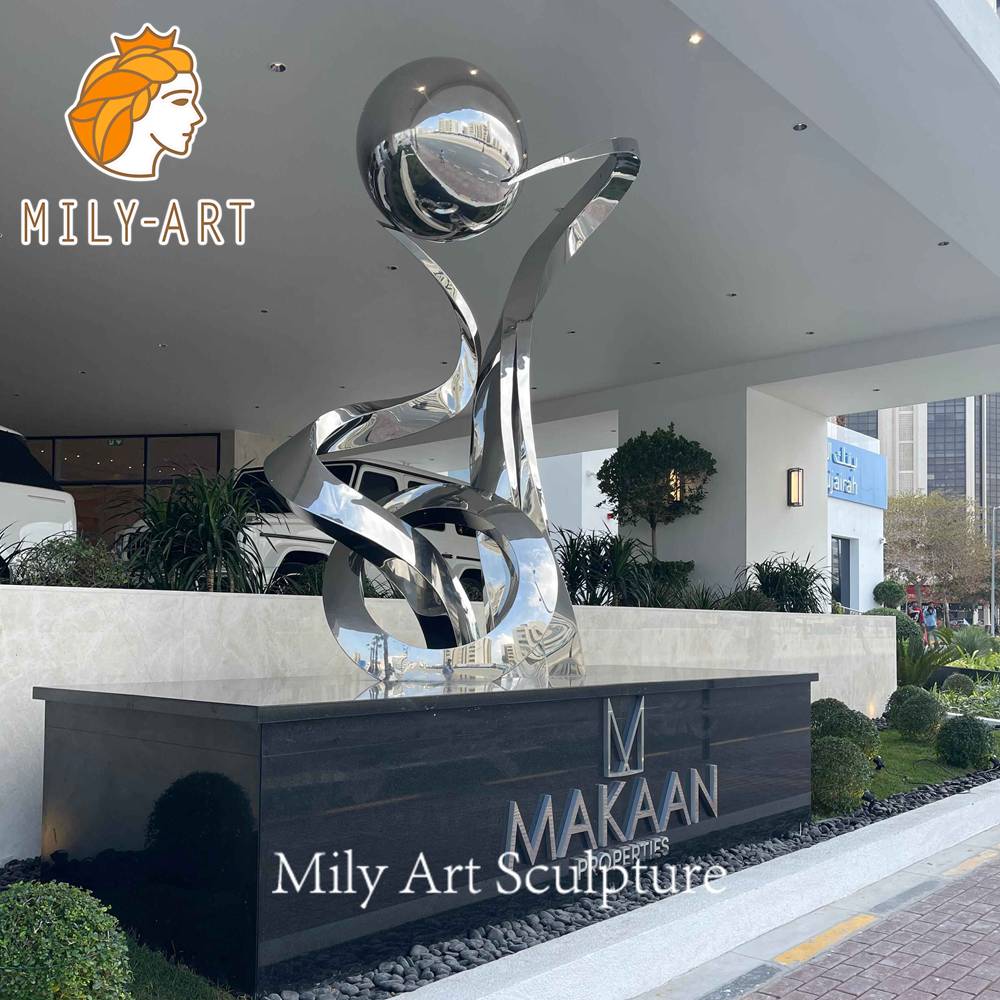 polished stainless steel sculpture at hotel entrance Dubai