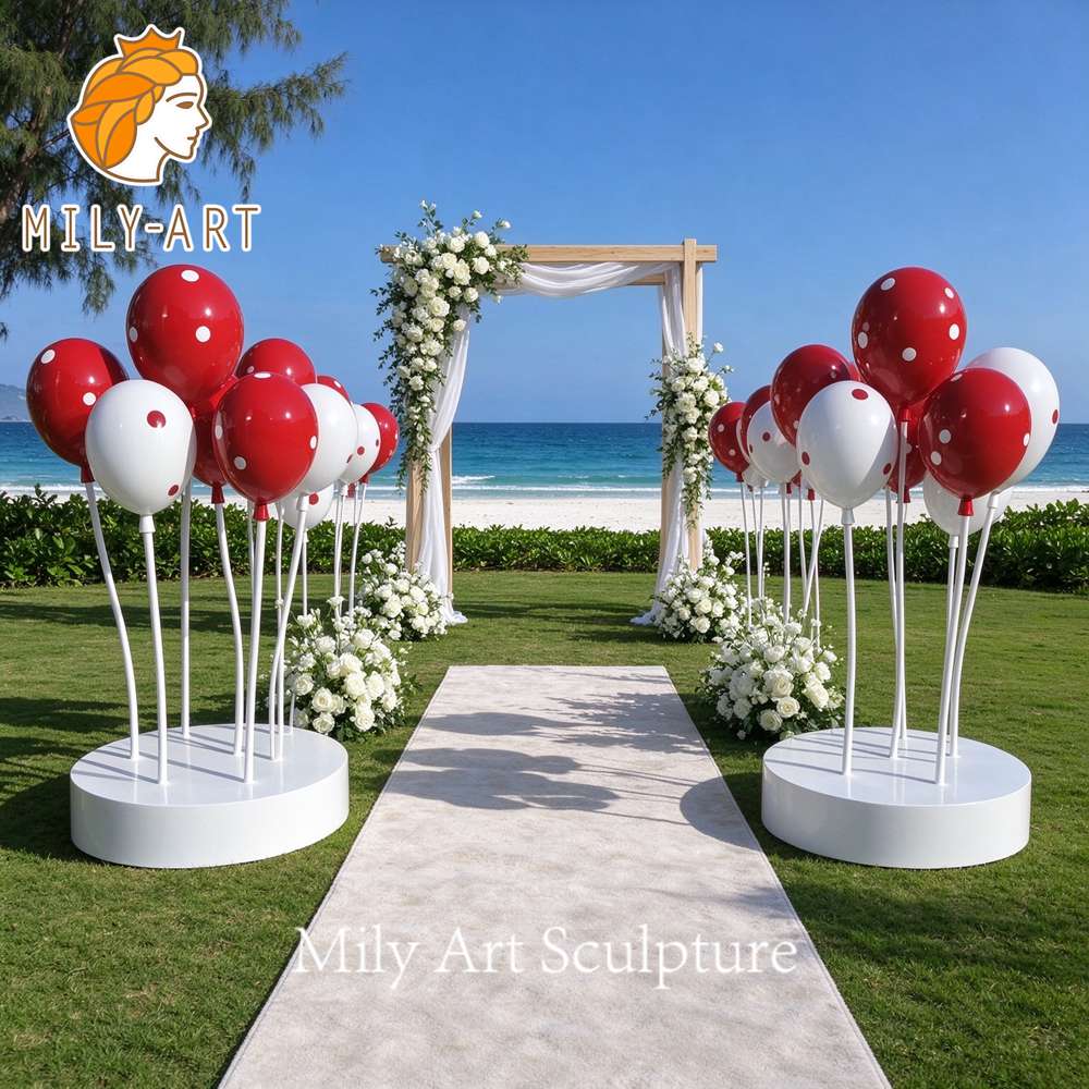 stainless steel balloon sculpture beach wedding aisle